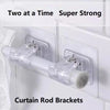 Clear plastic curtain rod brackets designed to hold two rods at a time for strong support.