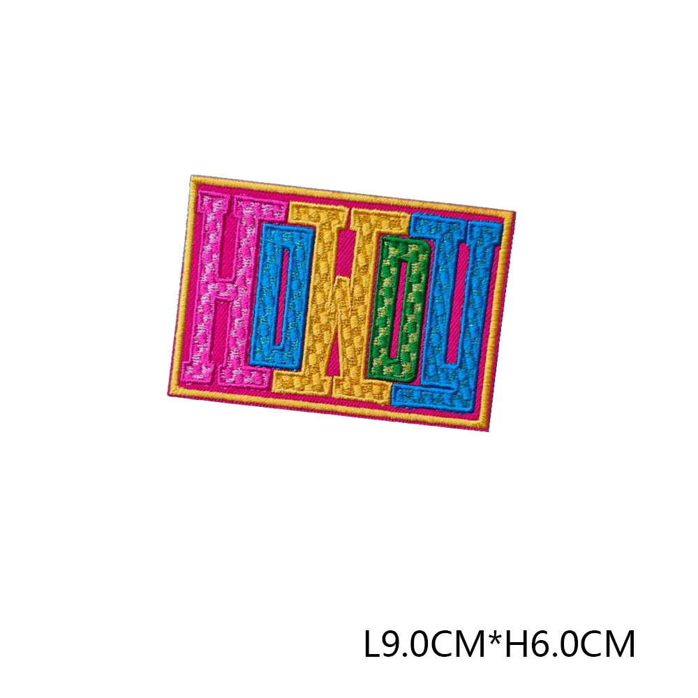 A set of iron-on embroidered letter patches spelling out I-R-O-N.
