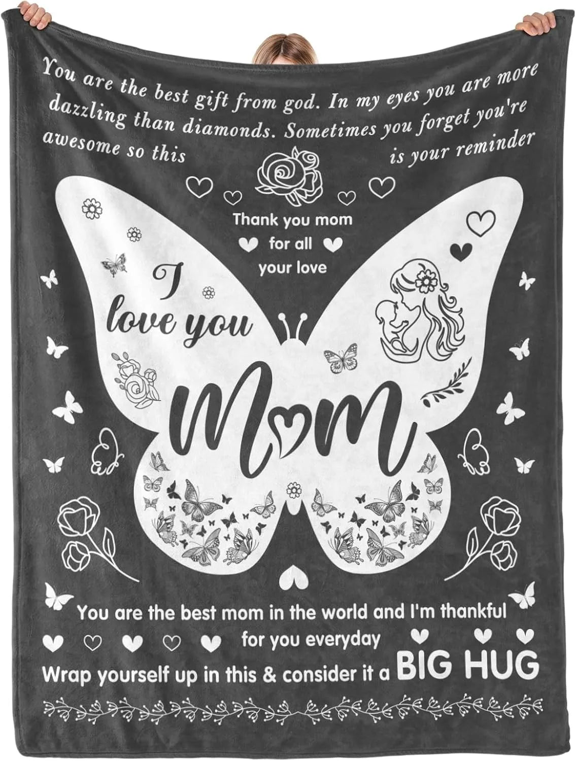 A black throw blanket featuring a butterfly design and text wishing love to mom