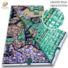 A bolt of grand wax print fabric featuring intricate patterns in purple, green, and black on a white background.
