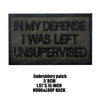 Black embroidered patch with text IN MY DEFENSE I WAS LEFT UNSUPERVISED on a tan background