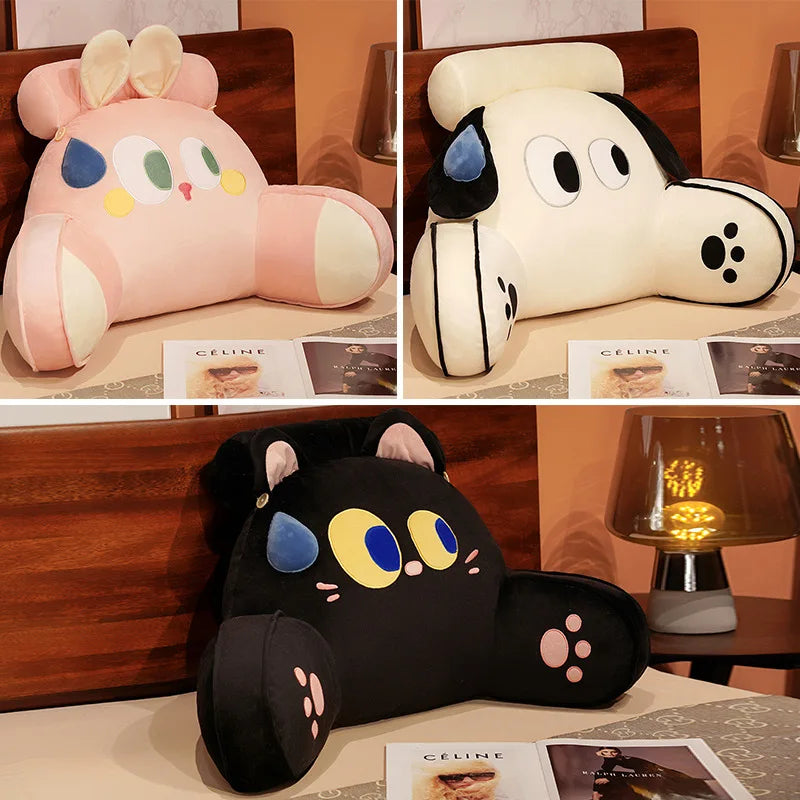 A collection of cute animal plush sofa cushions in pink, white, and black.