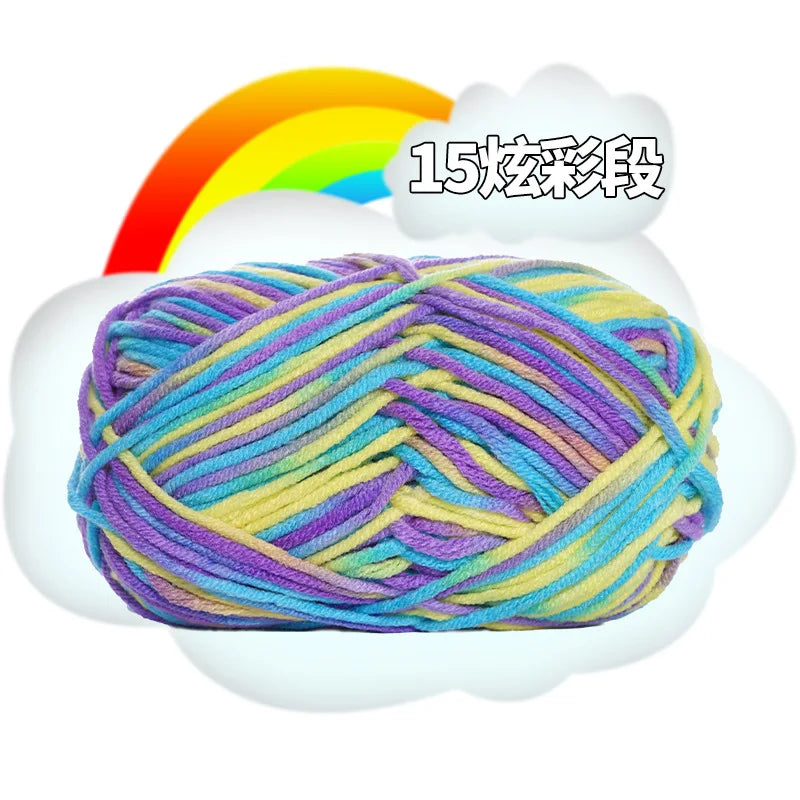 A ball of multi-colored yarn, featuring shades of purple, blue, yellow, and green, is shown against a white cloud with a rain