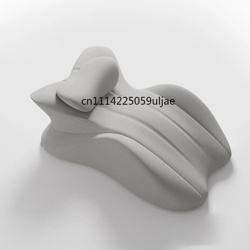 A gray ergonomic memory foam wedge pillow shown from a side view.