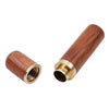 A close-up view of a wooden sewing needle set with brass tips and a metal ferrule.