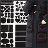 A black down jacket with various self-adhesive fabric repair patches applied to the exterior.