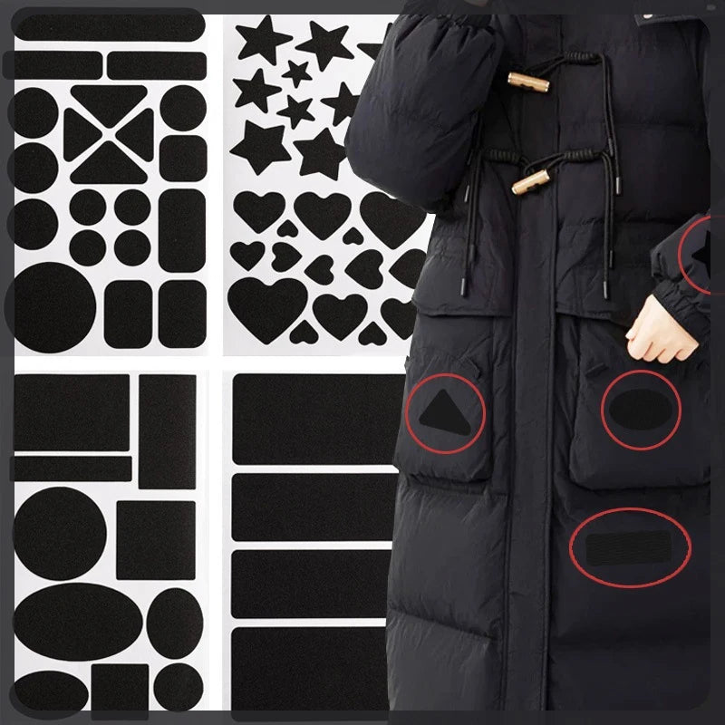 A black down jacket with various self-adhesive fabric repair patches applied to the exterior.