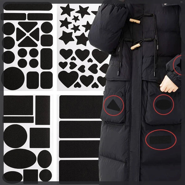A black down jacket with various self-adhesive fabric repair patches applied to the exterior.