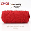 Two packs of red elastic yarn for crafting displayed on a white background.