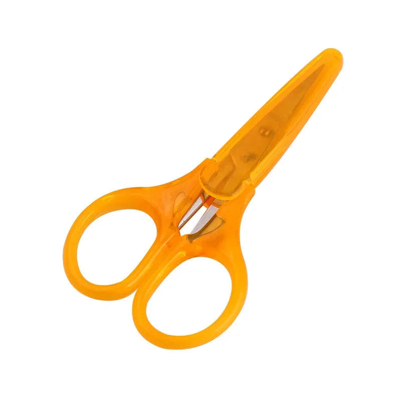 A pair of orange precision craft scissors with a protective cap.