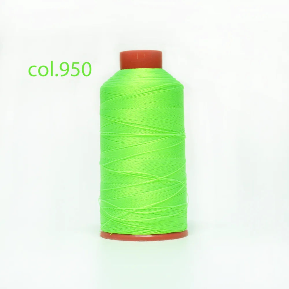 A spool of bright lime green heavy duty nylon sewing thread with a reddish-orange core.