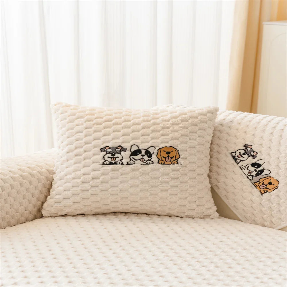 A cream-colored knitted cushion featuring a pattern of cartoon dogs.
