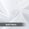 Soft fabric draped in a swirling white formation, showcasing a sheer voile curtain panel.
