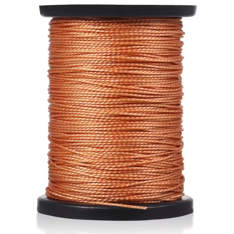 A spool of professional leather sewing thread in a coiled, orange-brown color.