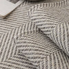 Close-up of a gray and white woven fabric texture used for an all-season anti-slip sofa cover.