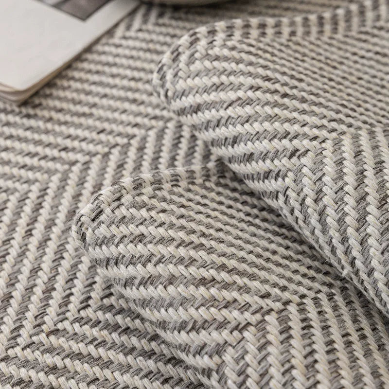 Close-up of a gray and white woven fabric texture used for an all-season anti-slip sofa cover.