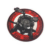 A circular embroidered patch featuring a silhouette of a Metal Gear Solid Foxhound helicopter against a red background.
