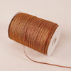 A roll of 10-meter gold and silver glitter satin ribbon with a white core.