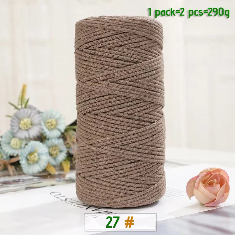 A spool of medium-thick, brown hand-woven cotton yarn for crafting, packaged as 2 pieces.