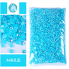 Bag of bright blue resin rhinestones and glitter for decoration