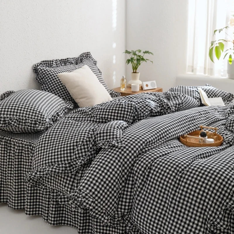 A black and white plaid duvet cover set displayed on a bed with natural light.