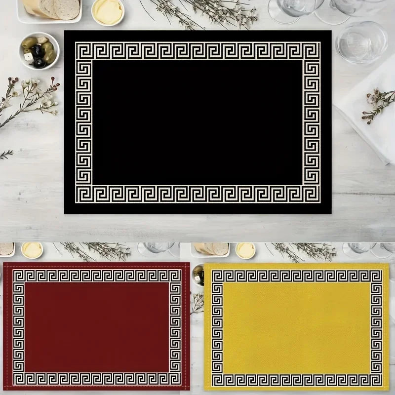 Three rectangular placemats with black, red, and yellow Greek key borders on a white background.