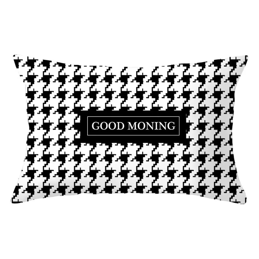A black and white checkered decorative pillow cover with the text Good Morning centered on it.