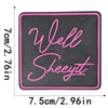 A square black embroidered patch with pink script text reading Well Sheeyt