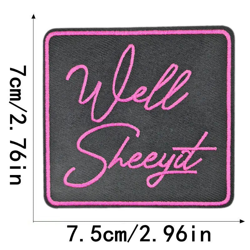 A square black embroidered patch with pink script text reading Well Sheeyt