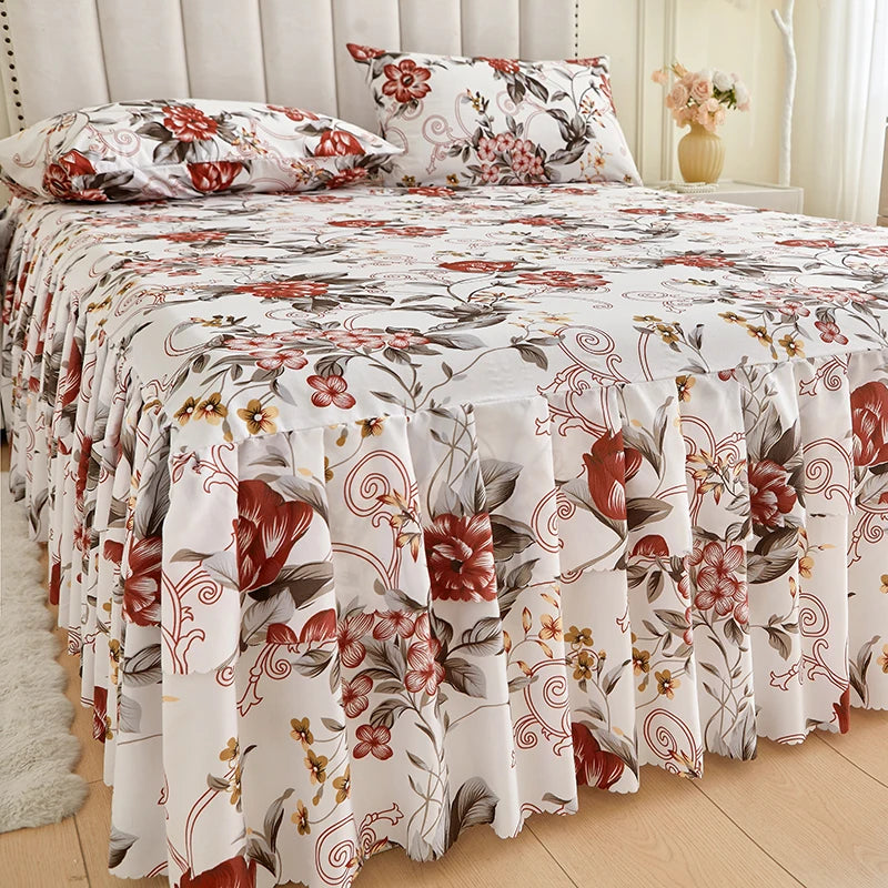 White floral ruffle bed skirt set with red and green botanical patterns