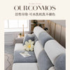 A modern, light gray and white sectional sofa with soft upholstery and decorative pillows.