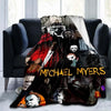 A dark horror themed throw blanket featuring multiple images of Michael Myers and other horror figures.