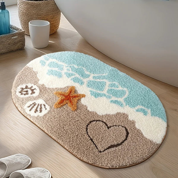 A beige and blue rug with a starfish and heart design in the shape of a beach wave