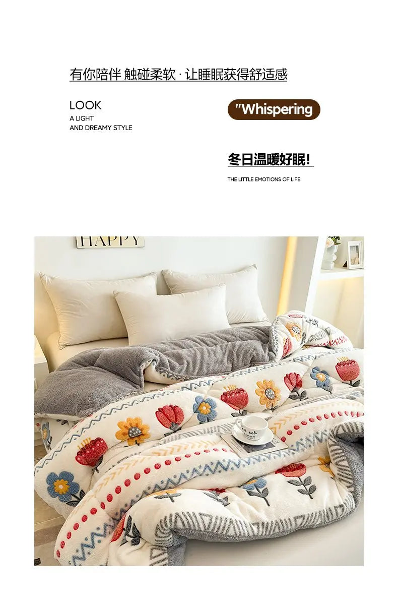 A cozy white and gray lamb'swool winter blanket with floral embroidery is displayed on a bed.