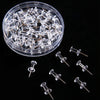 A clear plastic container filled with numerous push pins featuring steel tips.