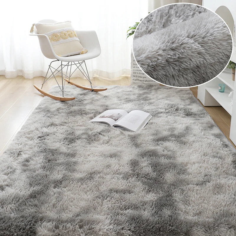 A fluffy gray plush area rug is displayed on a floor, with a white chair and a close-up of the rug's texture.