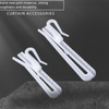 Two white adjustable curtain hanging hooks are displayed against a dark background.