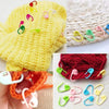 A collection of colorful stitch markers in various shapes and colors for knitting and crochet projects.