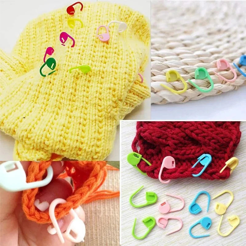 A collection of colorful stitch markers in various shapes and colors for knitting and crochet projects.