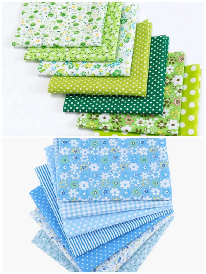 A stack of floral dot pattern cotton fabric squares in various shades of green and blue.