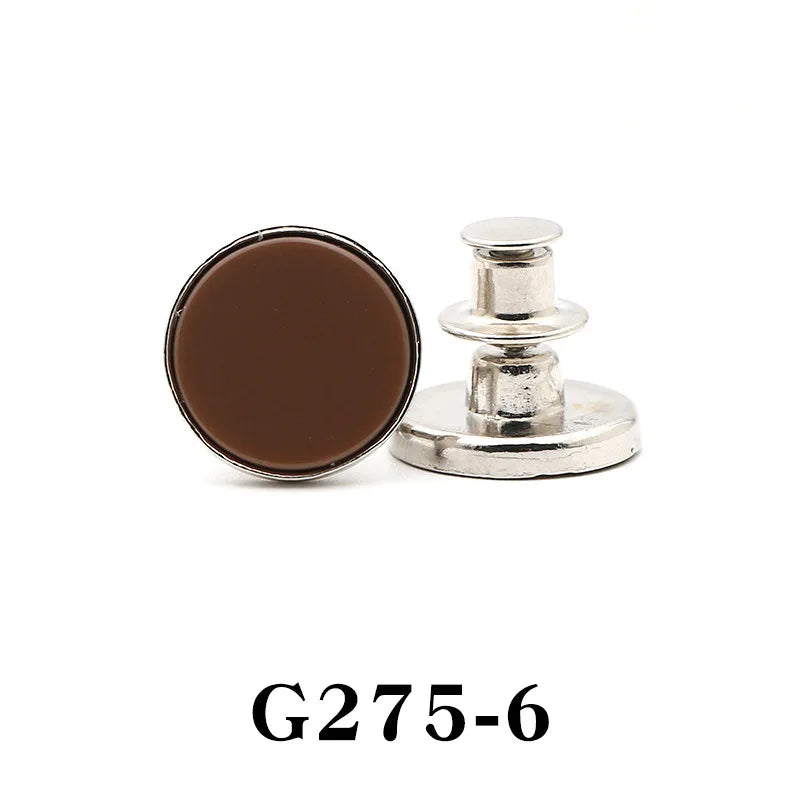 A round, dark brown button pin with a silver-toned base and post.