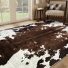 A cowhide print area rug featuring a brown and white mottled pattern in a western style.