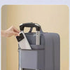A hand is opening a gray portable travel shoe organizer bag with a box rod design.
