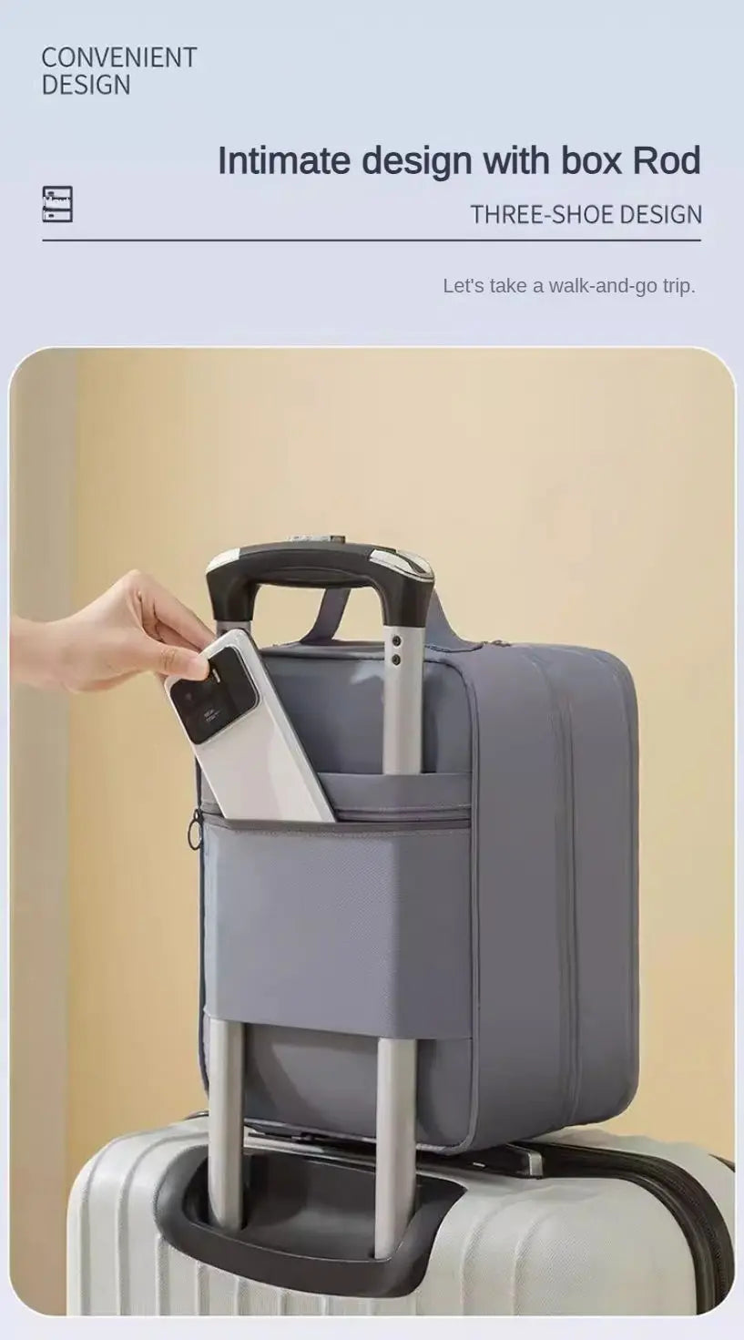 A hand is opening a gray portable travel shoe organizer bag with a box rod design.