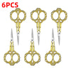 Six pairs of gold-colored crafting scissors with stainless steel blades and ornate handles