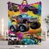 A colorful Monster Trucks flannel throw blanket featuring various monster truck designs and vibrant paint splashes.