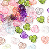 A collection of colorful resin flower bead caps in various shades including pink, purple, green, and clear.