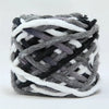 A ball of soft chenille knitting yarn featuring a mix of gray, black, and white strands.