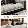 A beige sofa mat cover featuring a Christmas deer pattern and various floral accents on a light gray fabric.