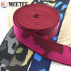 Roll of maroon camouflage elastic stretch ribbon for sewing and craft projects